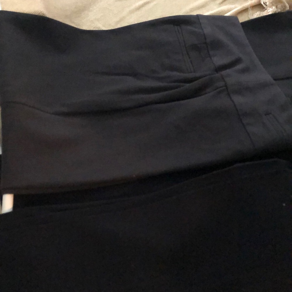 Three pair of dress pants.  Size 6